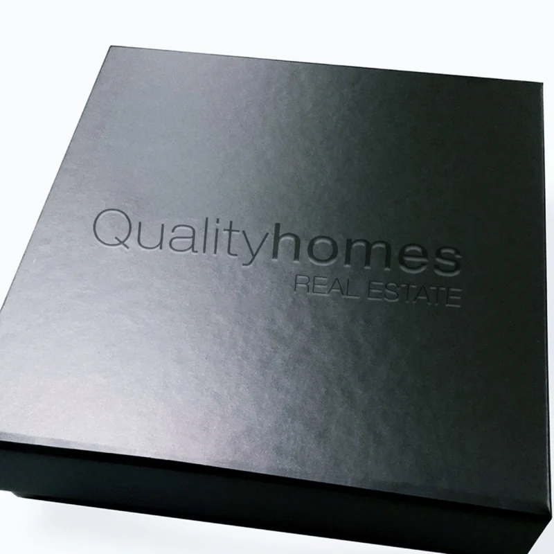 Quality Homes branded corporate gift box with logo, displaying a refined and sophisticated design