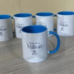 White ceramic mug with “Moments with Mom” printed in elegant typography, perfect for gifting mothers.