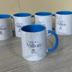 White ceramic mug with “Moments with Mom” printed in elegant typography, perfect for gifting mothers.