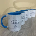 White ceramic mug with “Moments with Mom” printed in elegant typography, perfect for gifting mothers.
