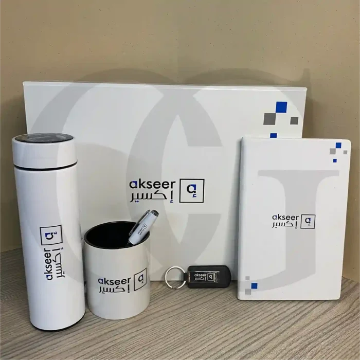 Momentum Productivity Kit featuring a bottle, mug, notebook, and keychain