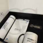 Momentum Productivity Kit featuring a bottle, mug, notebook, and keychain