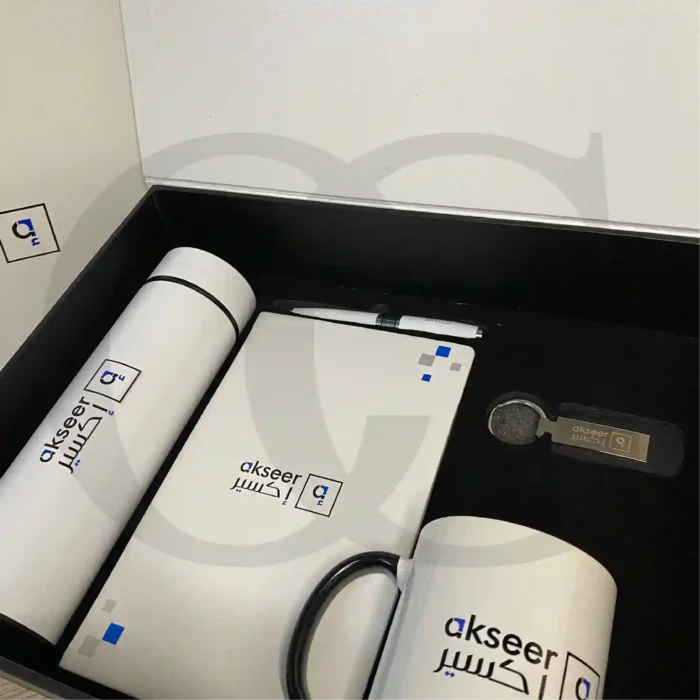 Momentum Productivity Kit featuring a bottle, mug, notebook, and keychain