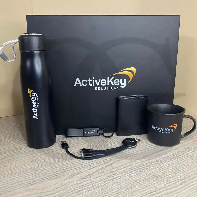 The Influence Box – premium corporate gift set with notebook, pen, and keychain for professionals.