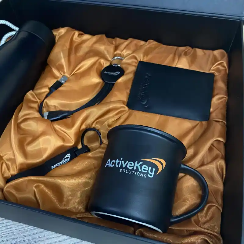The Influence Box – premium corporate gift set with notebook, pen, and keychain for professionals.