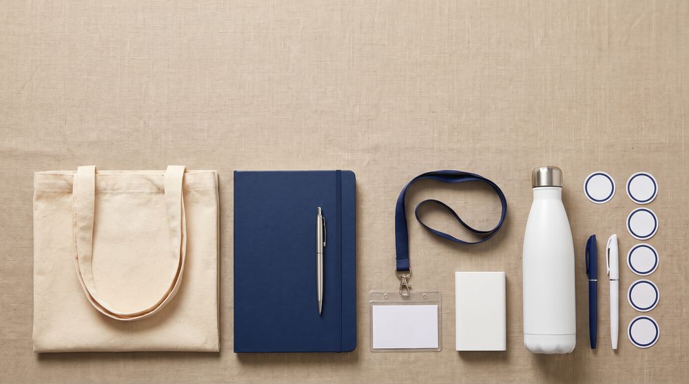 Branded career fair and job fair giveaways in Pakistan — canvas tote bag, notebook and pen, lanyard, power bank, water bottle and stickers